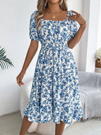 Floral puff sleeve dress with ruffled hem in lightweight fabric, featuring a feminine and stylish design from Shopimist.