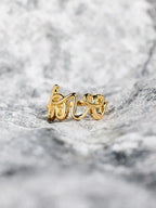 LOVE 18K gold-plated sterling silver ring with a sleek design, featuring a polished finish and subtle branding details.