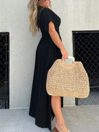 Full size slit V-neck smocked waist maxi dress by Trendsi, featuring a flowing silhouette and elegant design for plus size fashion.