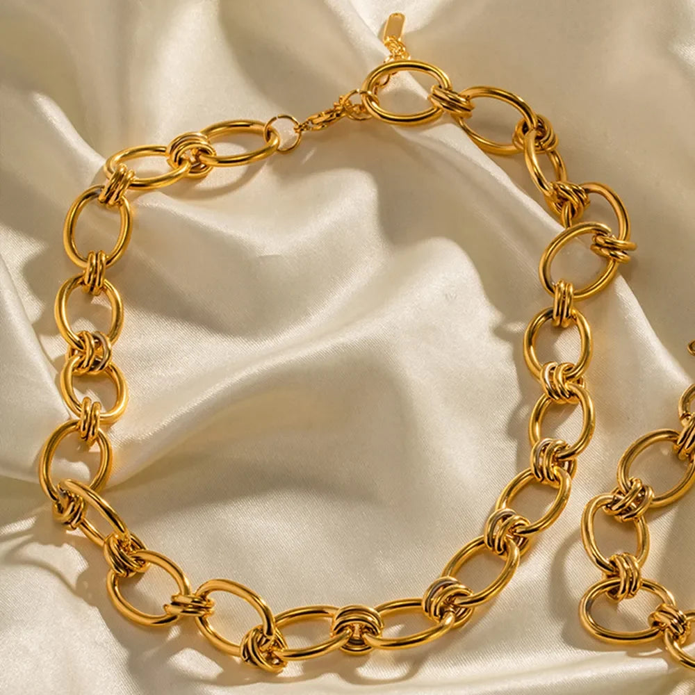 18K gold plated stainless steel necklace with a delicate chain, featuring a sleek and modern design.