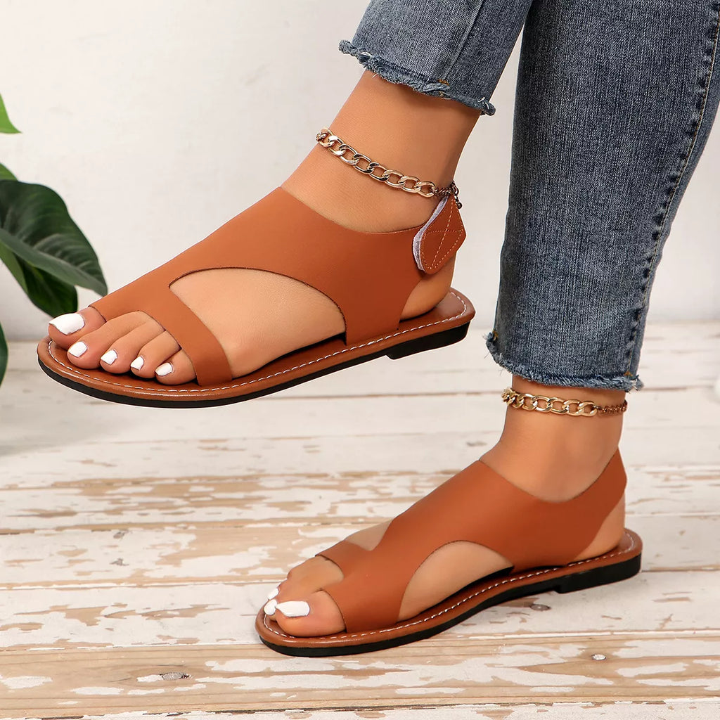 Leather toe loop flats sandals by Shopimist featuring a sleek design with comfortable straps and a stylish open-toe style.