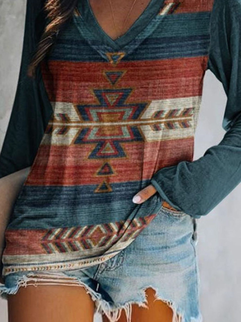 Plus size Trendsi geometric print V-neck long sleeve T-shirt with a casual fit, featuring a modern geometric pattern and comfortable fabric.