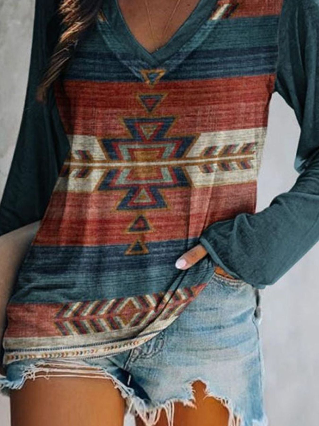 Plus size Trendsi geometric print V-neck long sleeve T-shirt with a casual fit, featuring a modern geometric pattern and comfortable fabric.
