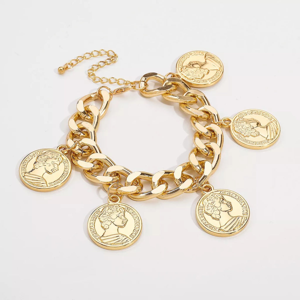18K gold-plated coin charm bracelet with detailed coin charms on a delicate chain, showcasing elegant jewelry craftsmanship.