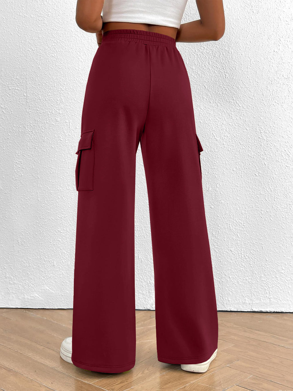 Women’s high-waisted casual cargo pants with drawstring from Trendsi, lightweight utility pants with multiple pockets and relaxed fit.