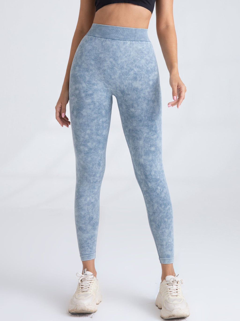 Black V-back scrunch seamless yoga leggings from FitiqueFit, showing the V-back detail and fitted, high-waist design for activewear.