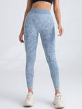 Black V-back scrunch seamless yoga leggings from FitiqueFit, showing the V-back detail and fitted, high-waist design for activewear.