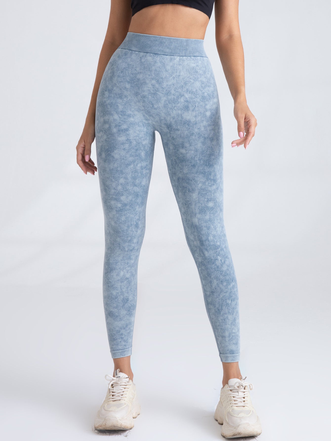 Black V-back scrunch seamless yoga leggings from FitiqueFit, showing the V-back detail and fitted, high-waist design for activewear.