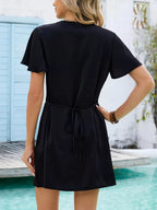 Women's notched flutter sleeve mini dress by Trendsi, casual summer shift dress with stylish design and comfortable fit.