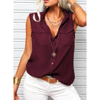 Women's sleeveless top with lapel collar, loose fit, solid color, and front pockets, by Plush Fashion Hub.
