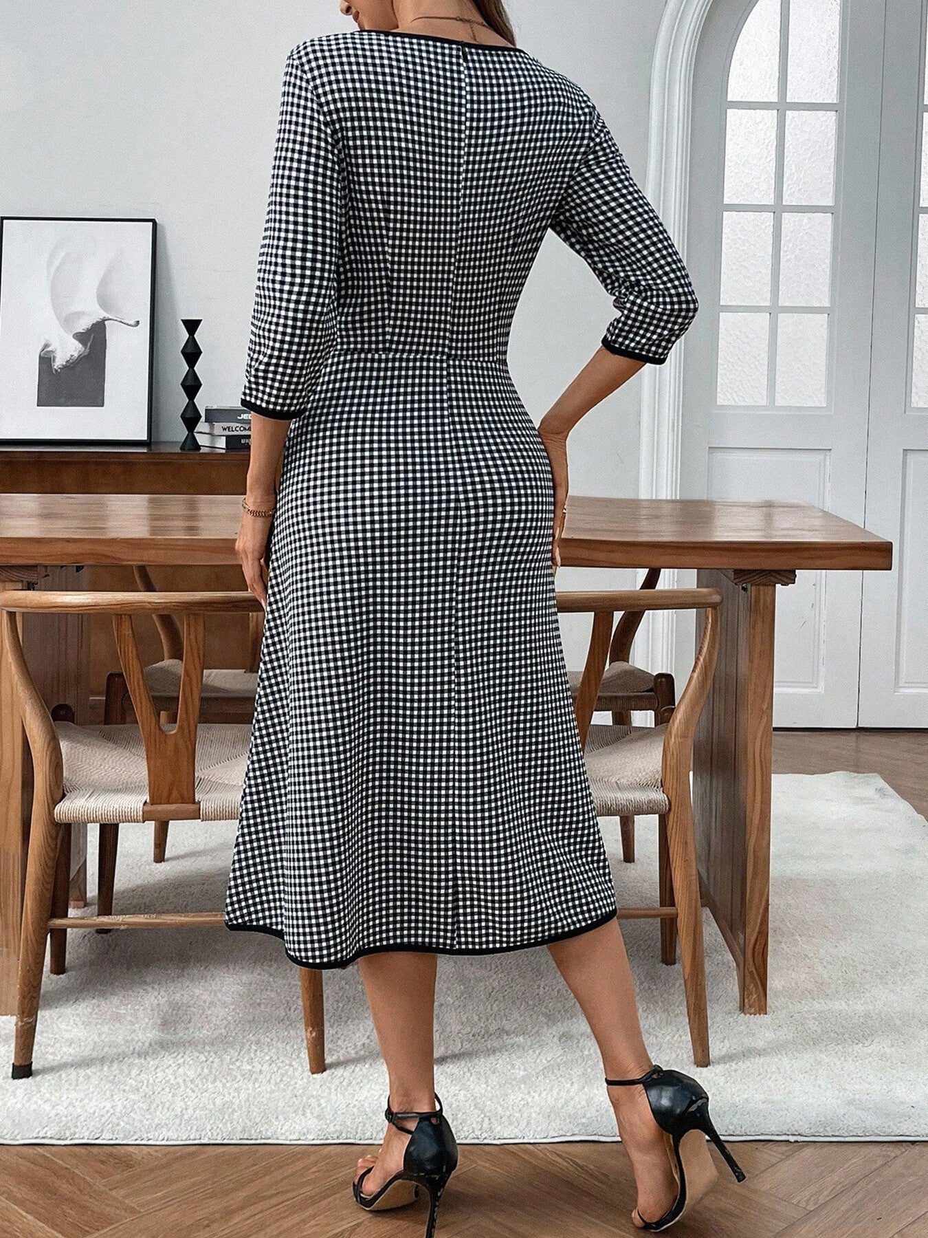Classic plaid round neck midi dress with 3/4 sleeves from Trendsi, featuring a stylish and comfortable design perfect for casual wear.