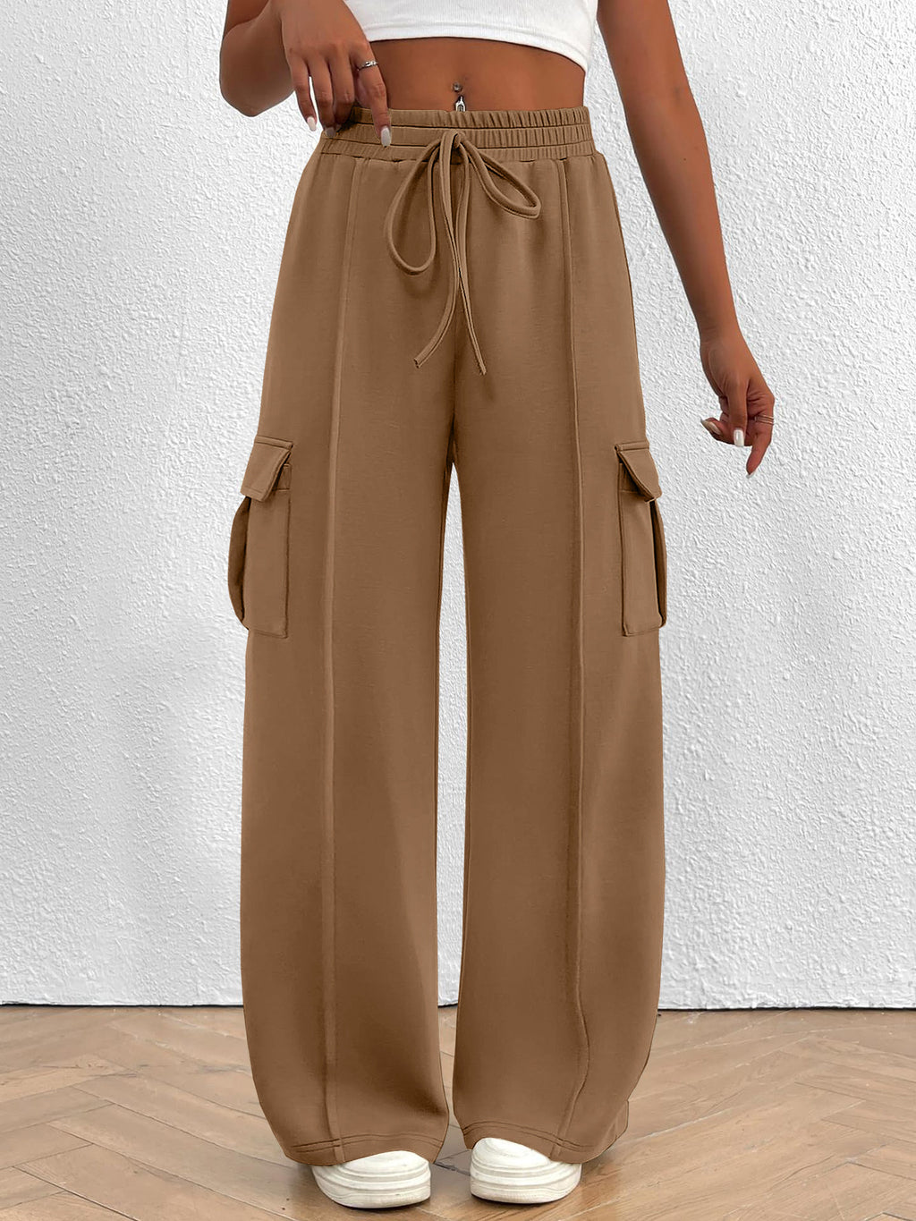 Women’s high-waisted casual cargo pants with drawstring, lightweight utility pants from Trendsi, featuring multiple pockets and relaxed fit.