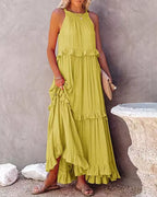 Ruffled tiered sleeveless maxi dress from Plush Fashion Hub featuring flowing fabric and feminine ruffle details.