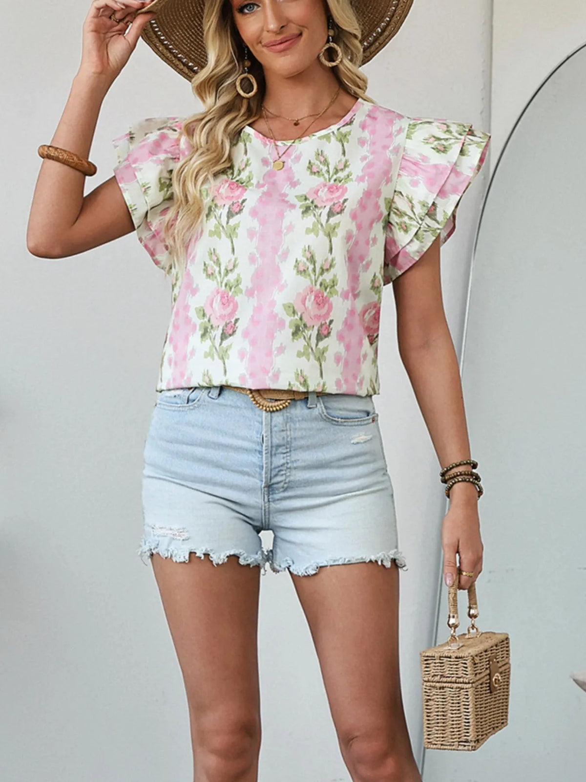 Floral print ruffled sleeve blouse by Plush Fashion Hub, featuring a feminine design with floral patterns and ruffled sleeve details.