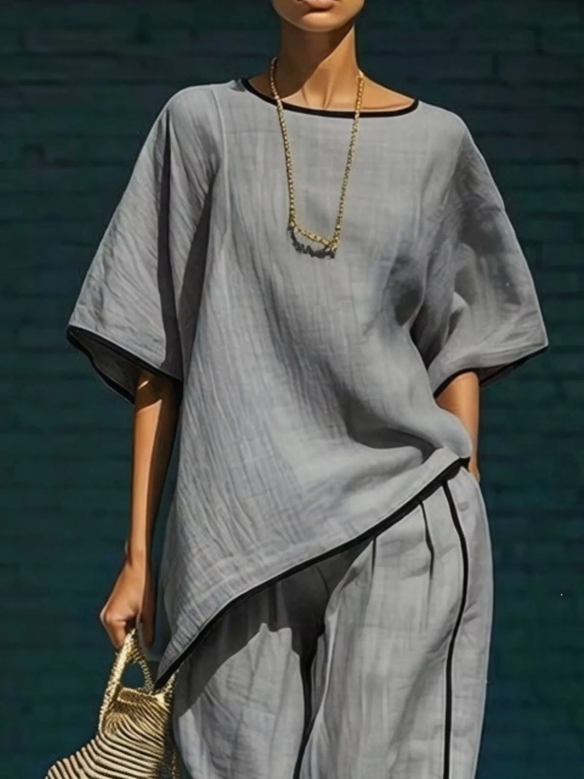 Plush Fashion Hub contrast trim round neck top and pants matching set, stylish casual wear with color-block design.
