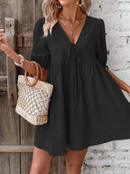 Cotton V-neck tie-front mini dress with puff sleeves, stylish and lightweight, perfect for casual or summer wear.
