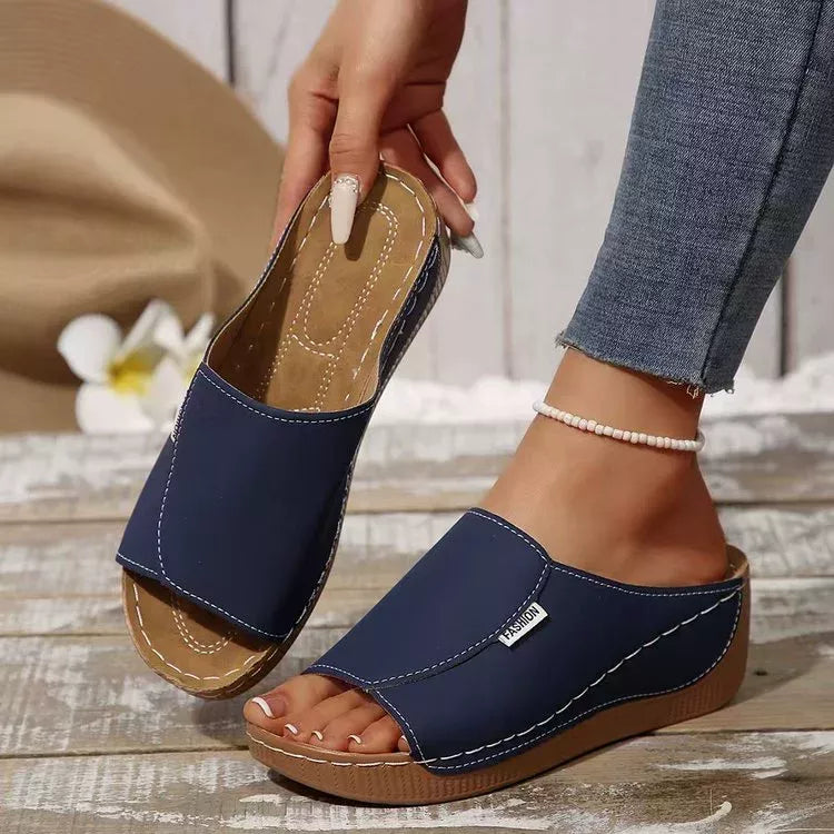 Open toe wedge sandals by Shopimist featuring a stylish design with a comfortable platform and ankle straps.