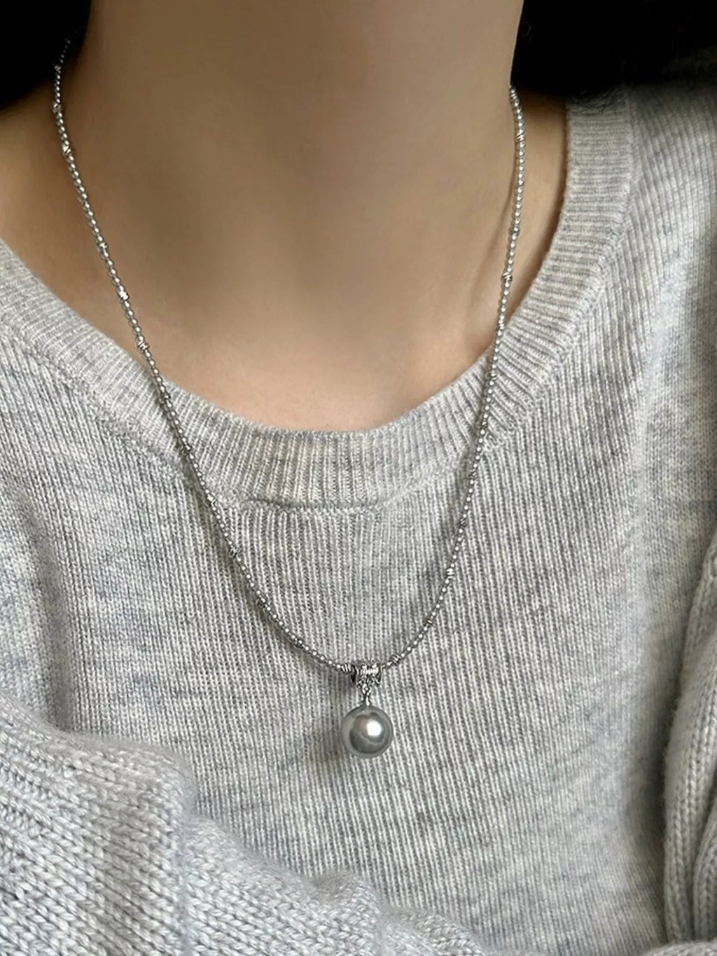 Elegant pearl pendant necklace by Shopimist featuring a single lustrous pearl on a delicate chain.