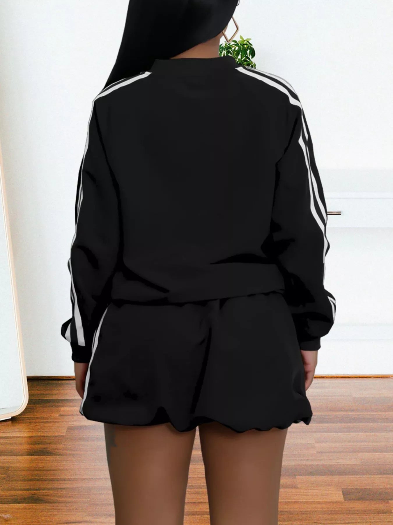 Striped zip-up outerwear and shorts set by Plush Fashion Hub, featuring a casual, stylish matching outfit with a zip front and bold stripes.
