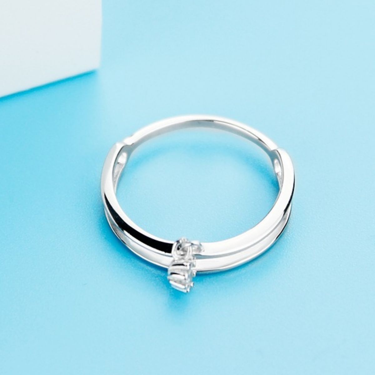 925 sterling silver double layered ring with intricate design, showcasing layered bands and polished finish.