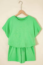 Pair of trendy solid color puffy loose fit drawstring shorts in a 2-piece outfit, shown in the trendy Rings collection.