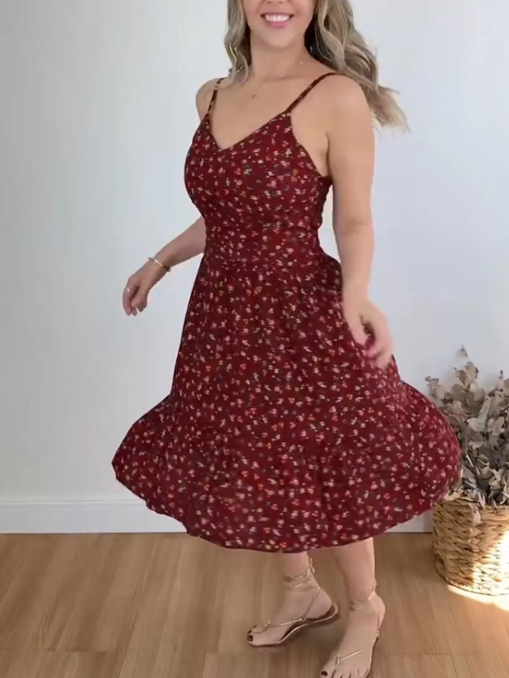 Floral print spaghetti strap midi dress with ruffle hem from Trendsi, showcasing a flowy, feminine design perfect for summer wear.