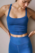 Scoop neck active wear tank top from Trendsi, lightweight and fitted for workout or casual wear, shown in black fabric.