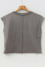 Light blue Ellianna Fit Cotton Tank Top by Threaded Pear displayed on a hanger, showcasing its sleeveless design and soft fabric.