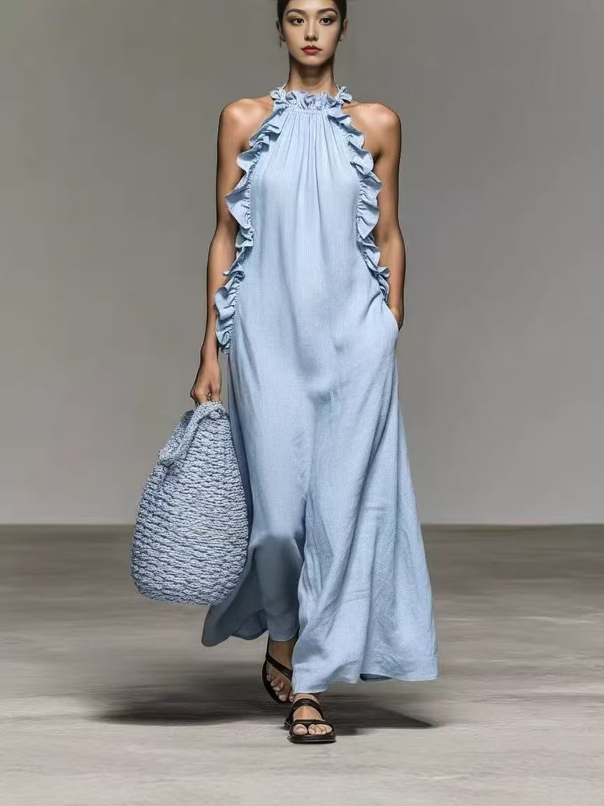 Flowy beige halter neck sleeveless dress with ruffles and pockets, casualwear by Plush Fashion Hub showing the front view.