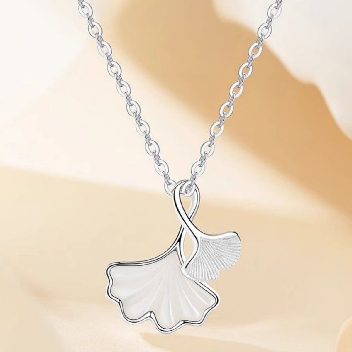 Ginkgo leaf pendant necklace by Shopimist featuring a delicate gold-tone leaf charm on a fine chain.
