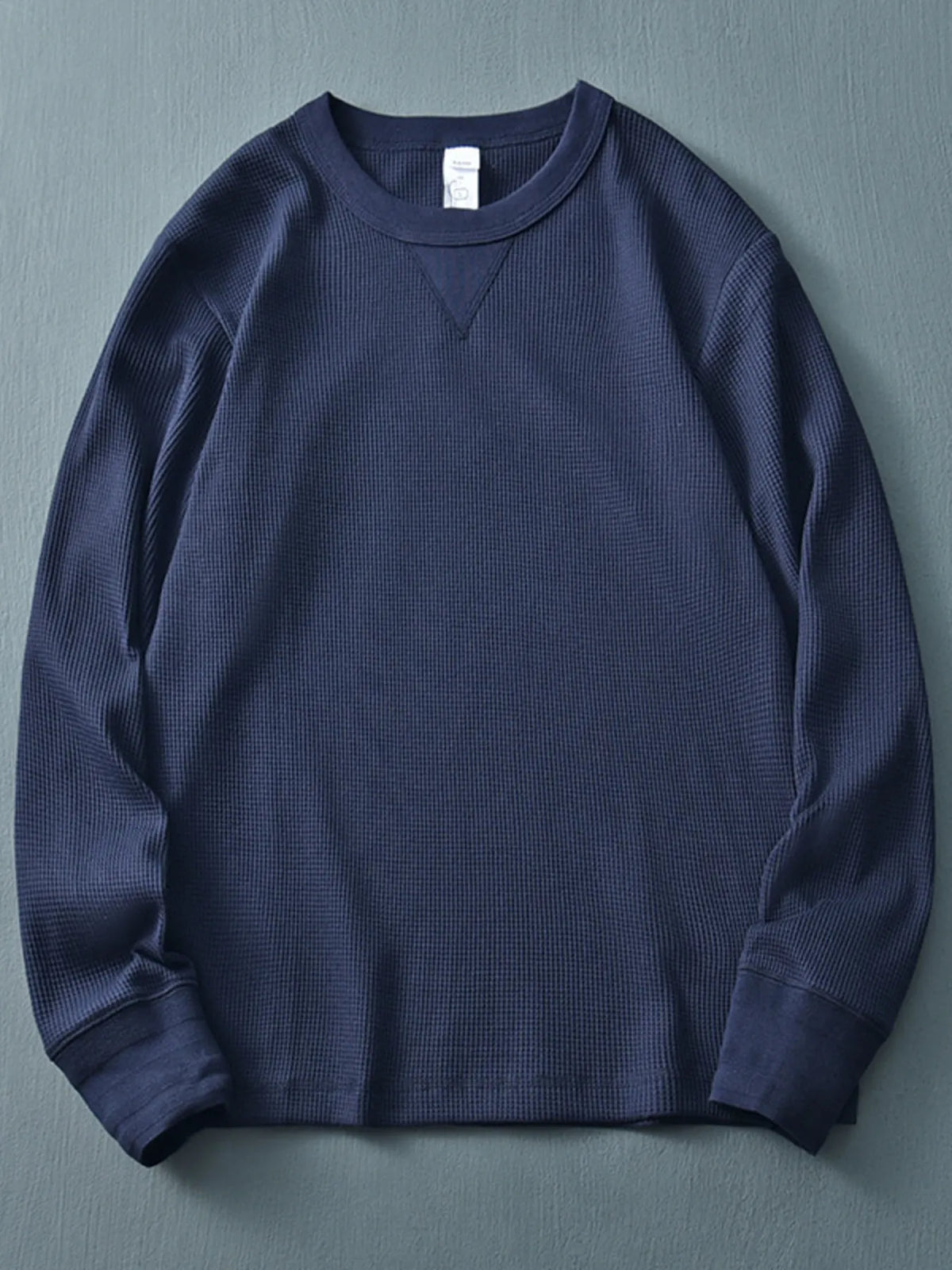 Men's plus size round neck long sleeve T-shirt by Trendsi, shown in a natural fit with soft fabric and classic design.