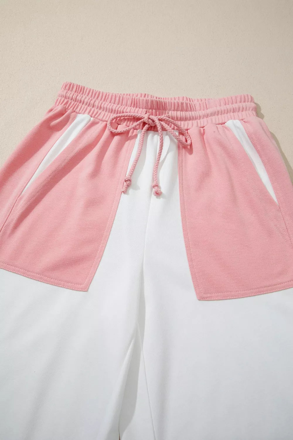 Two-tone color block patchwork tee and drawstring loose pants set by Trendsi, casual fashion with vibrant color blocking.