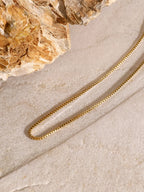 18K gold-plated three-layered cross necklace with intricate design, stylish jewelry piece, suitable for everyday wear.