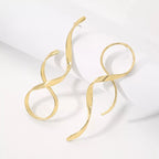 Silver alloy spiral drop earrings with a sleek, modern design, featuring dangling loops and polished finish by Shopimist.