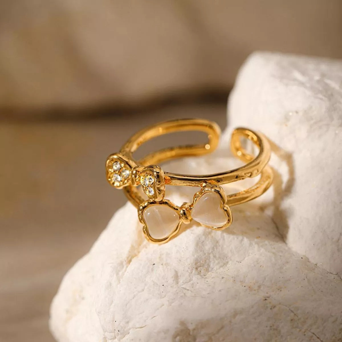 18K gold-plated bow open ring from Plush Fashion Hub featuring a delicate, stylish design on a sleek gold band.