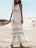 Ethereal V-neck lace sleeveless maxi dress with tassel accents, flowing fabric, and elegant design by Trendsi.