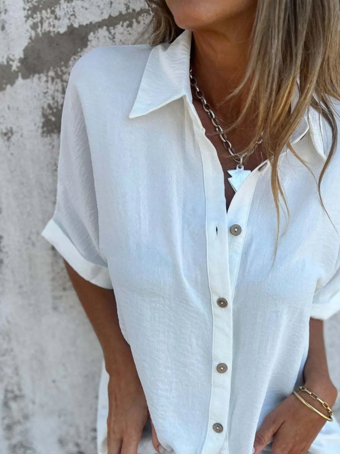 Women's collared half sleeve button-down blouse from Trendsi, featuring a sophisticated office top with a classic design.