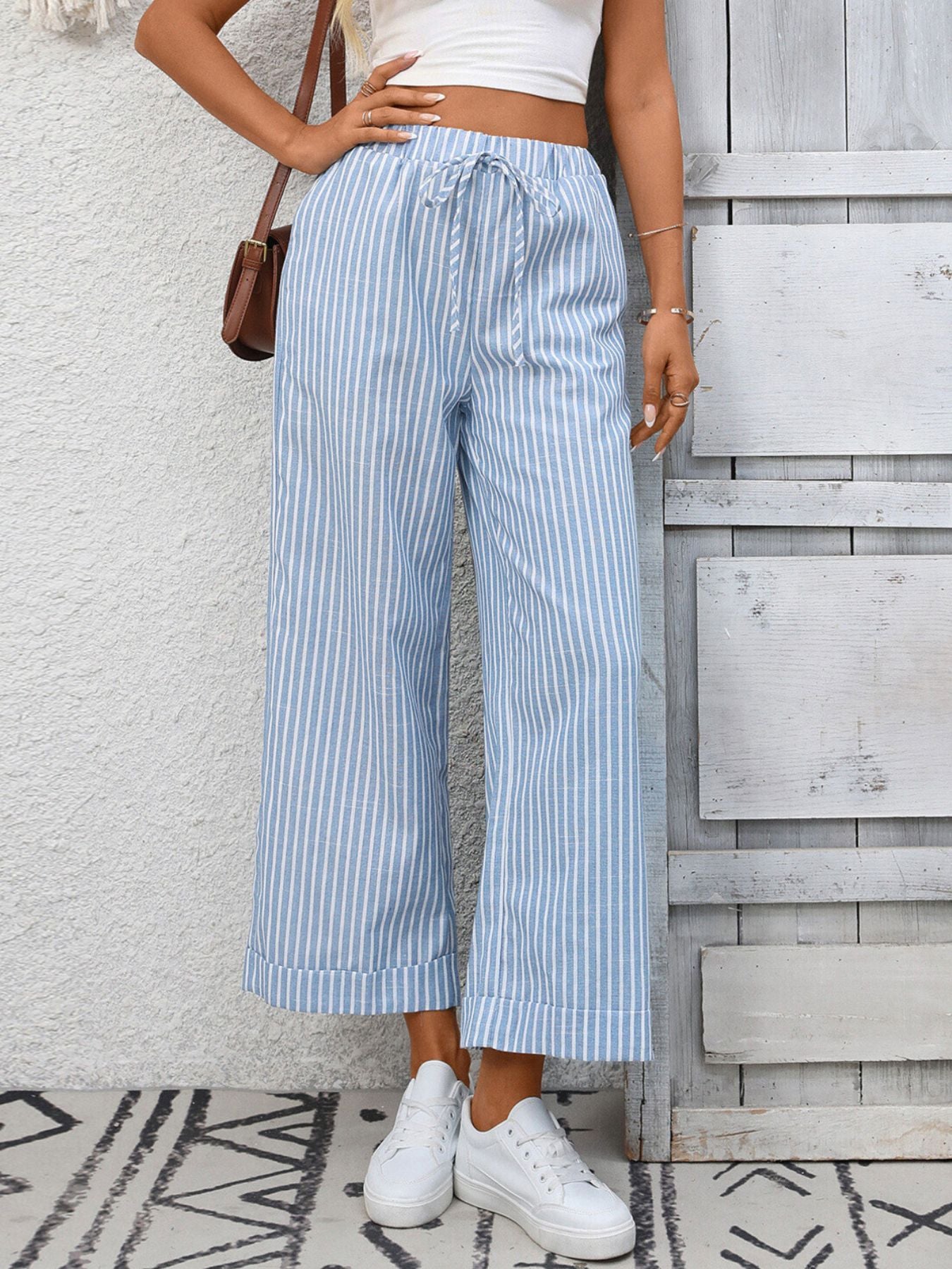 Women's striped wide-leg drawstring pants with pockets, casual fashion by Trendsi, featuring comfortable fit and stylish design.