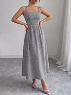 Square neck gingham midi dress by Shopimist featuring a fitted bodice and flowy skirt in classic black and white gingham pattern.