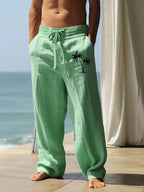 Men's full-size palm tree wide leg pants set by Shopimist, featuring a relaxed fit and tropical print, perfect for casual wear.