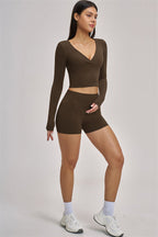 Fitglutes Activewear Swoon Long Sleeve Crop Top featuring a fitted design and breathable fabric for workout and gym sessions.