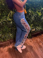 Distressed denim jeans by Plush Fashion Hub featuring ripped details and a classic fit, shown in a side view.