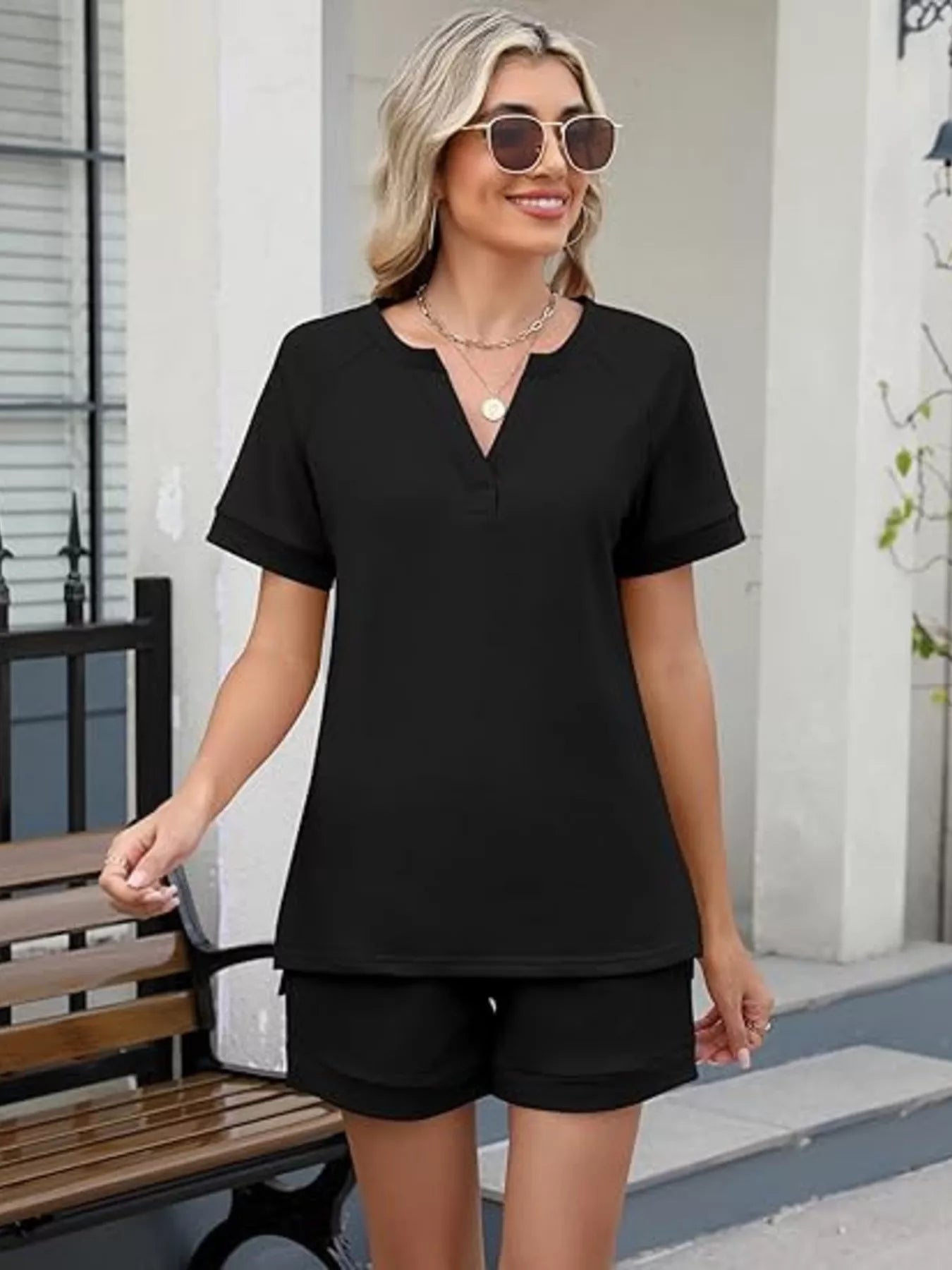 Solid color short sleeve top and shorts two-piece set from Trendsi, casual and comfortable summer outfit for women.