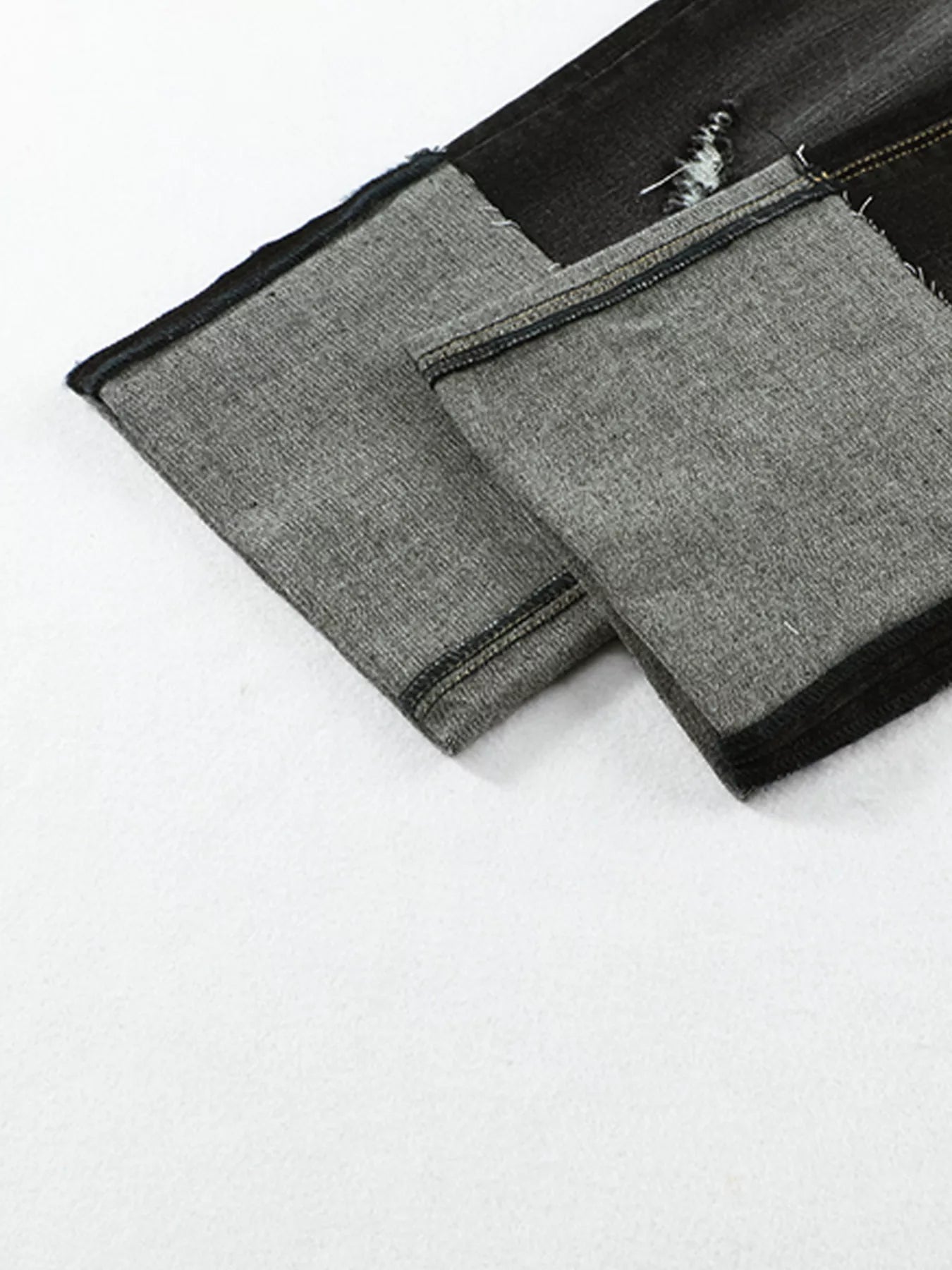 High waist distressed straight leg jeans from Trendsi, showing a close-up of the ripped details and classic denim texture.