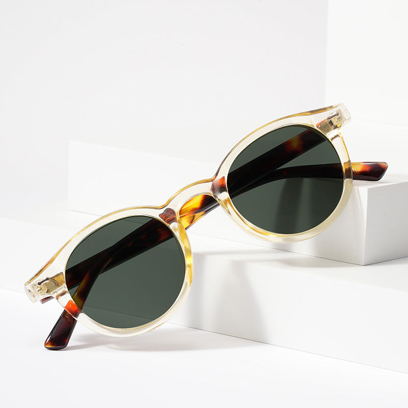 Retro round UV400 sunglasses with tinted European-style frames by FitiqueFit, featuring classic design and dark lenses.