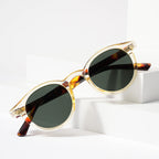 Retro round UV400 sunglasses with tinted European-style frames by FitiqueFit, featuring classic design and dark lenses.