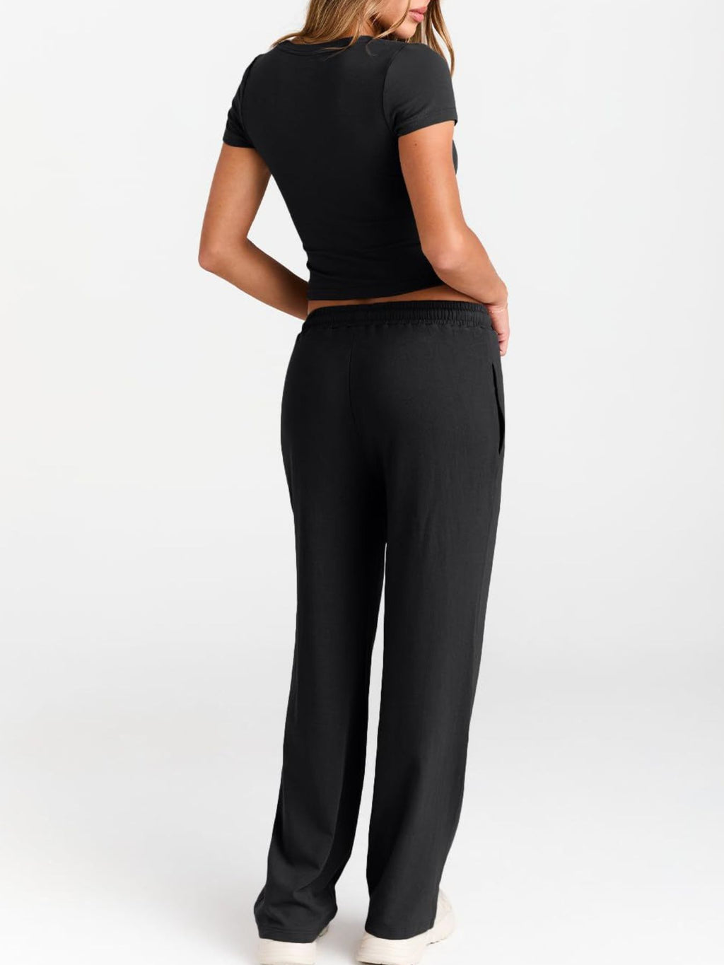 Women's round neck short sleeve T-shirt and drawstring lounge set by Trendsi, casual 2-piece comfort outfit, front view.