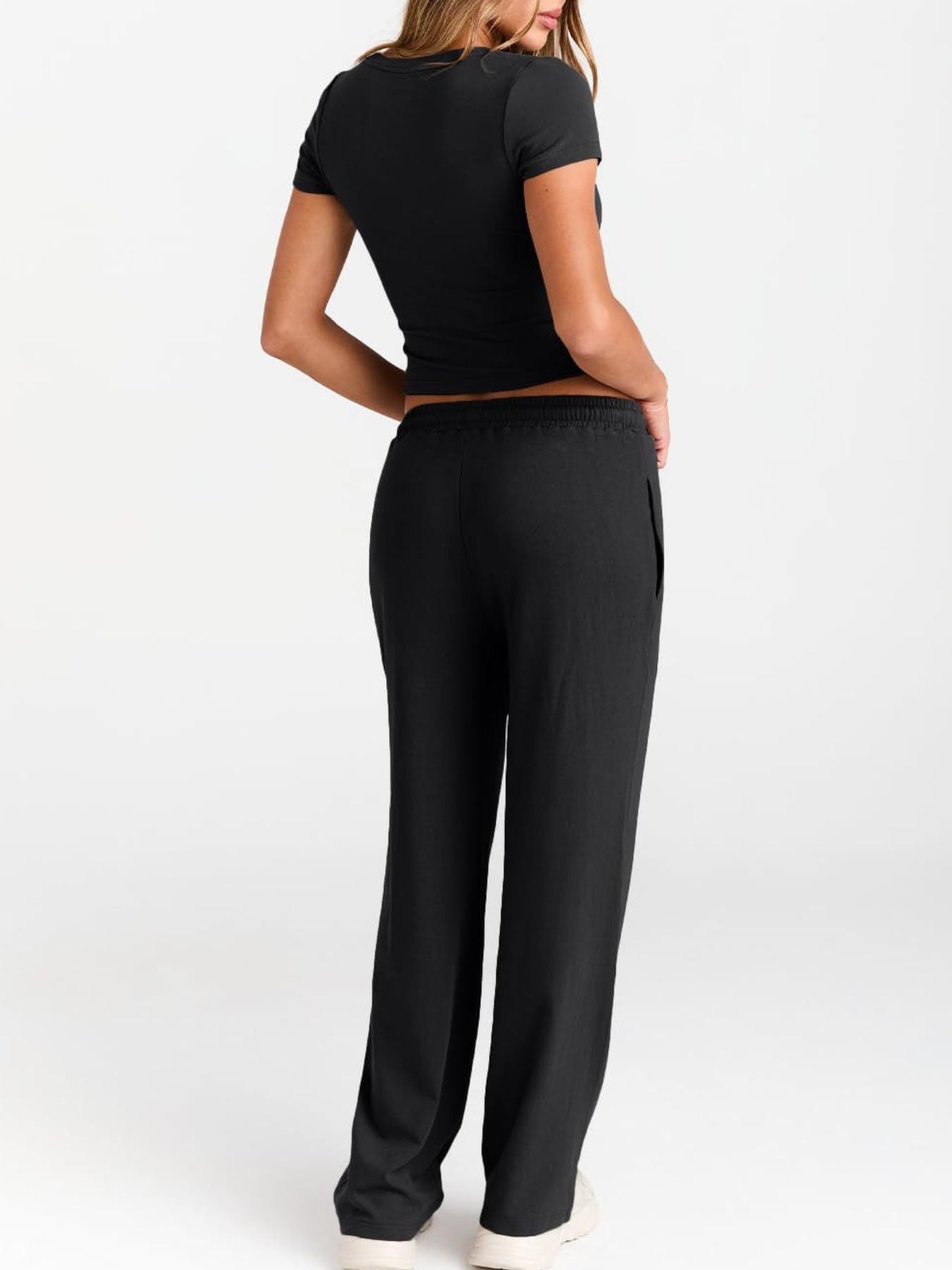 Women's round neck short sleeve T-shirt and drawstring lounge set by Trendsi, casual 2-piece comfort outfit, front view.