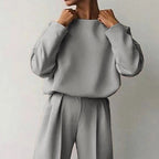 Women’s solid color 2-piece loungewear set with long sleeve top and pleated pants by FitiqueFit, casual and comfortable.