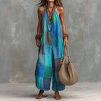 Women's plaid print jumpsuit by Plush Fashion Hub featuring sleeveless design, wide-leg style, and suspender straps.